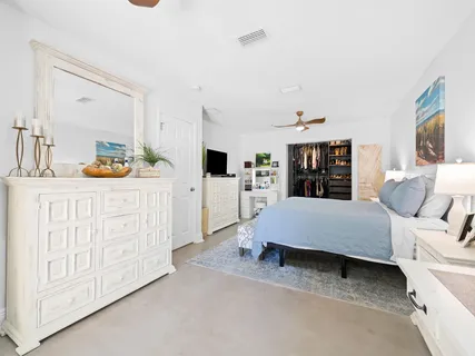 a bedroom with furniture and window