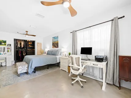 a bedroom with a bed and furniture