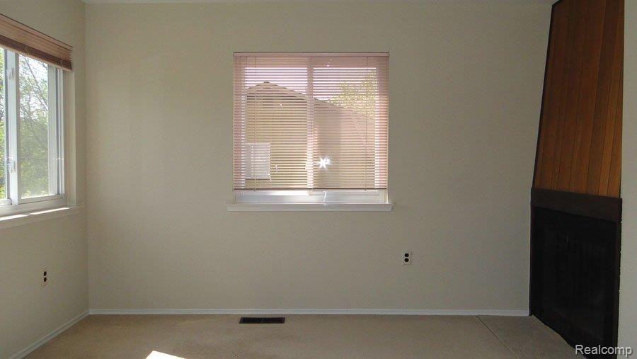 22528 Deerfield Road Novi, MI 48375 - Photo 9 of 14 Master Sitting with Fireplace