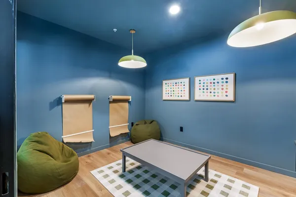 a bedroom with a bed and a lamp