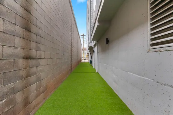 a view of a pathway with a yard