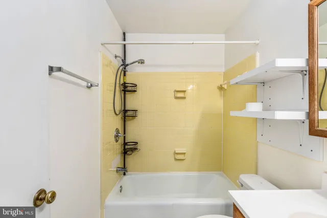 a bathroom with a shower and a tub