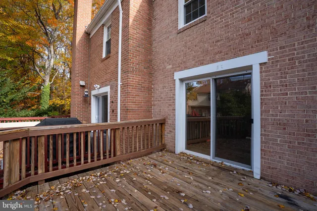 a view of wooden deck and a yard