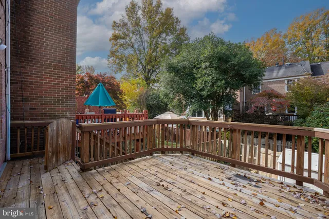 a view of a house with wooden deck front door