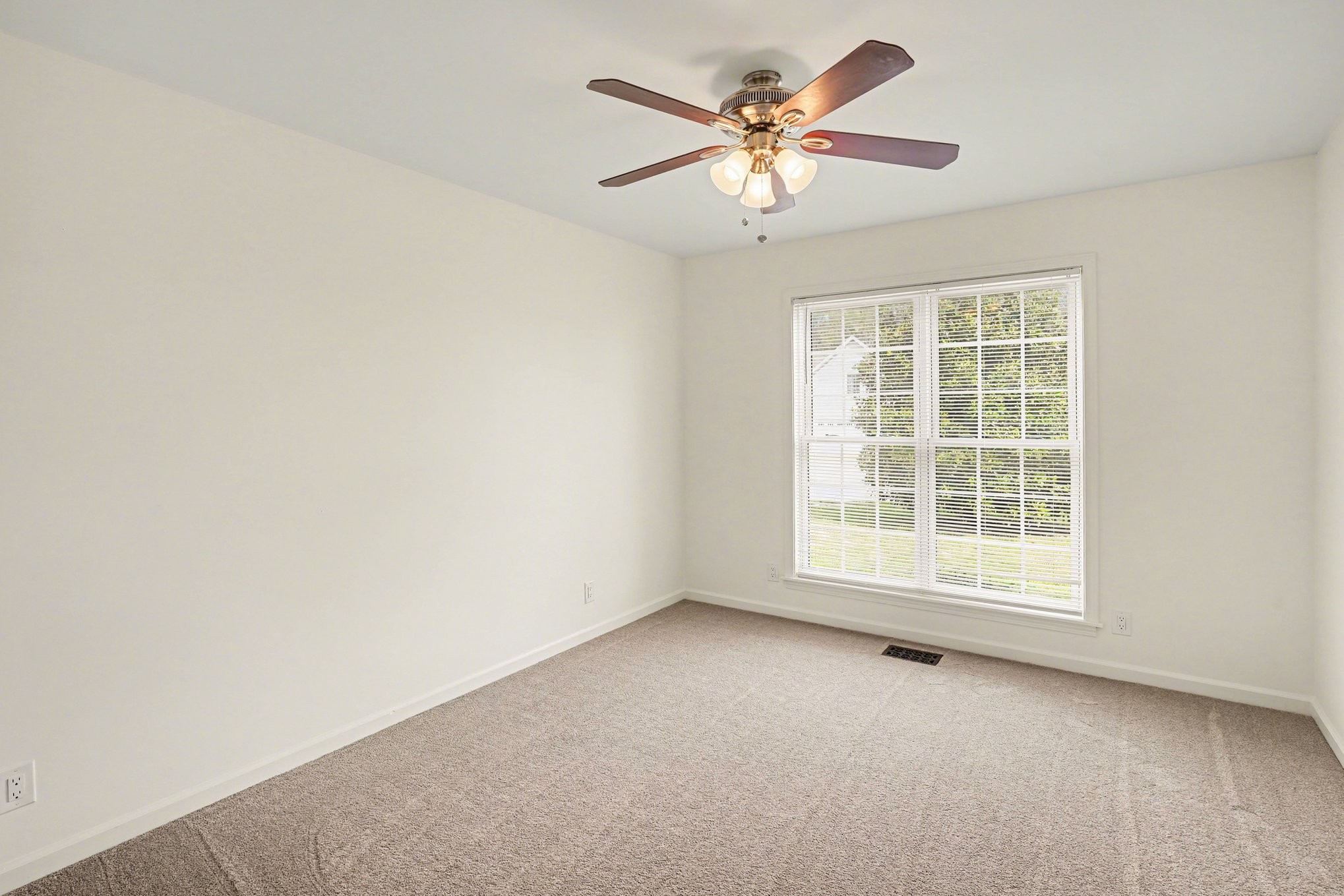 161 Fieldstone Lane Springfield, TN 37172 - Photo 14 of 26 an empty room with a window and a fan
