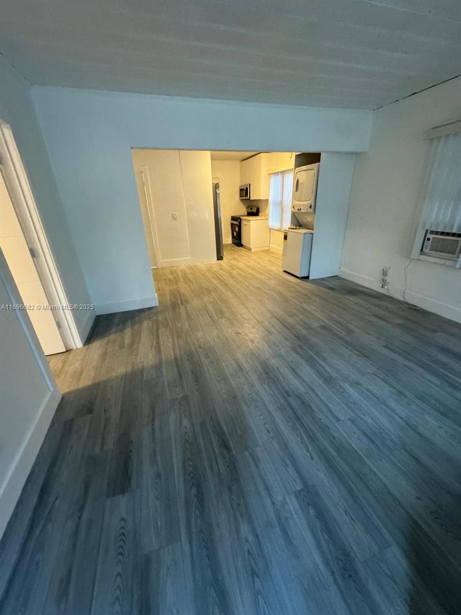 501 Wendell Road, Unit A Fort Pierce, FL 34950 - Photo 2 of 17 a view of empty room with wooden floor and fan