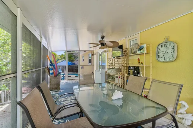 a dining room with furniture a rug and wooden floor