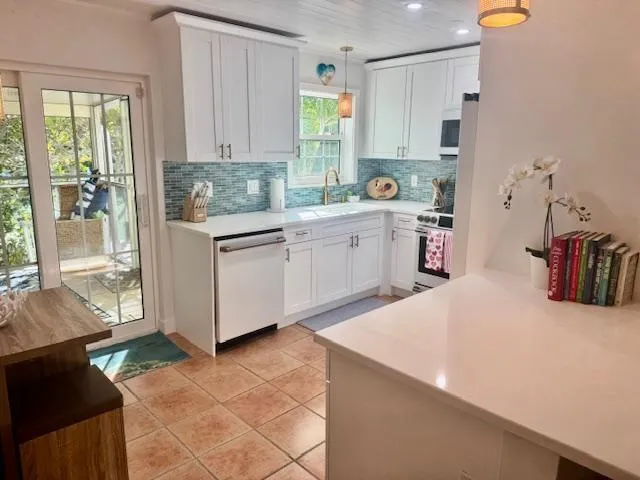 a kitchen with a cabinets and window