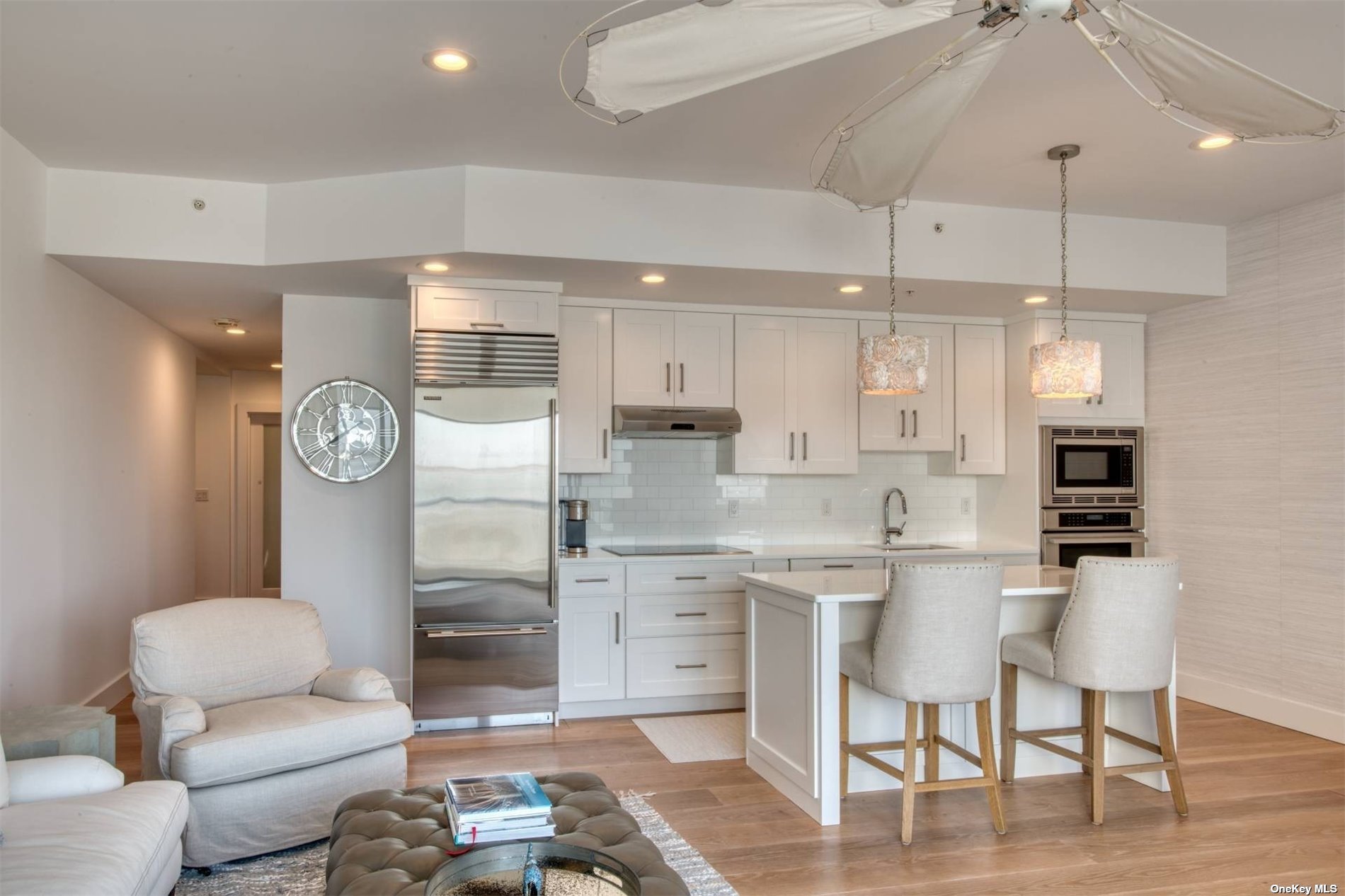 a kitchen with a refrigerator a sink and a stove