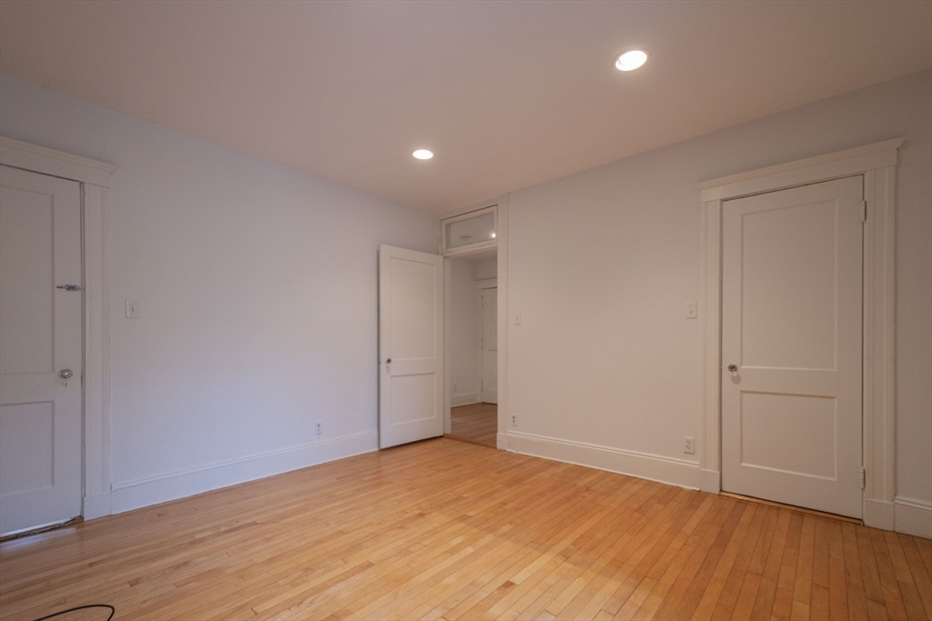 2 Newport Road, Unit 5 Cambridge, MA 02140 - Photo 15 of 18 a view of an empty room with wooden floor