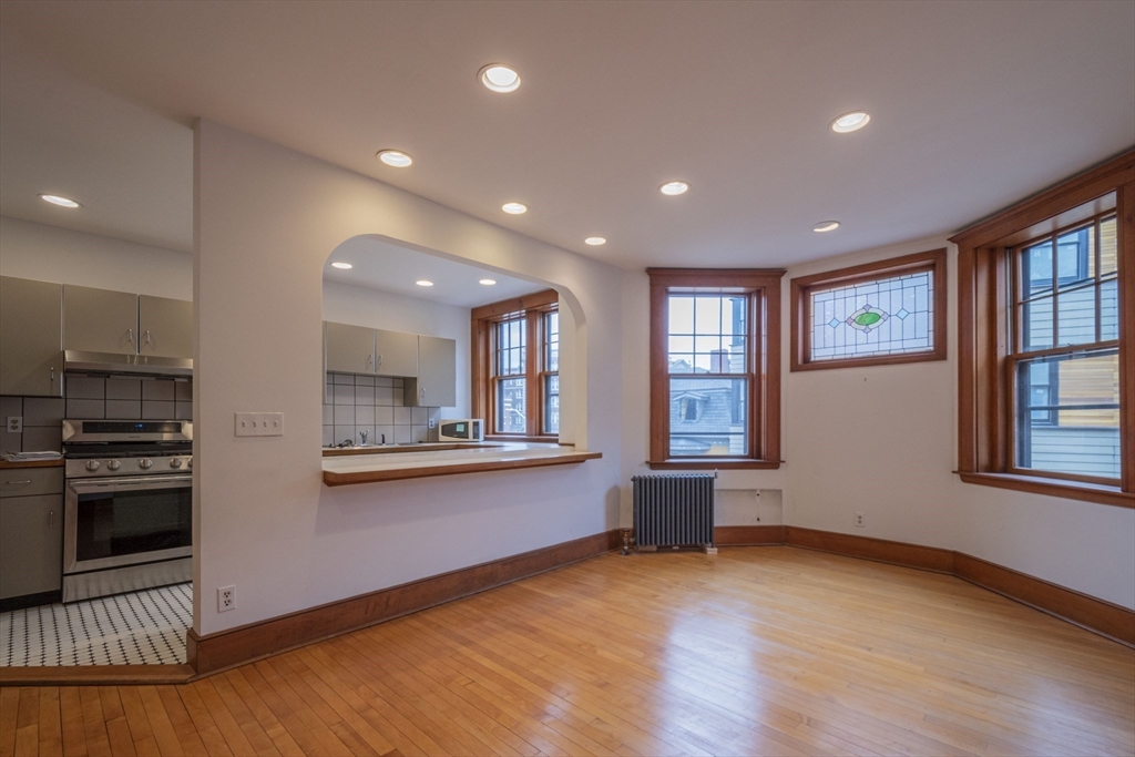 2 Newport Road, Unit 5 Cambridge, MA 02140 - Photo 2 of 18 a view of kitchen with sink and wooden floor