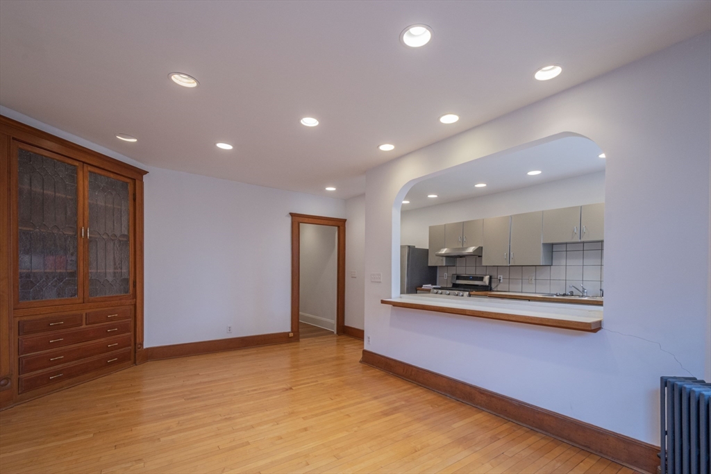 2 Newport Road, Unit 5 Cambridge, MA 02140 - Photo 3 of 18 a kitchen with stainless steel appliances a refrigerator and a stove top oven