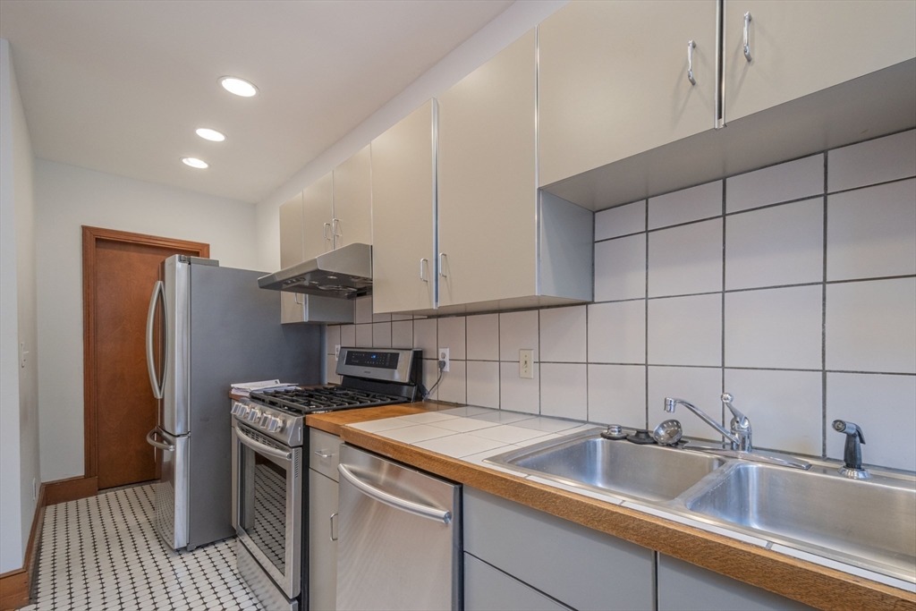 2 Newport Road, Unit 5 Cambridge, MA 02140 - Photo 6 of 18 a kitchen that has a sink and a refrigerator