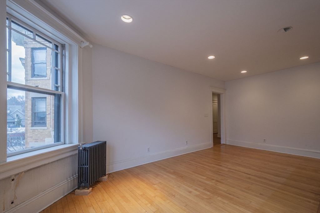 2 Newport Road, Unit 5 Cambridge, MA 02140 - Photo 10 of 18 a view of an empty room with a window