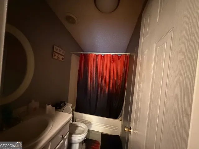 a bathroom with a sink and a toilet