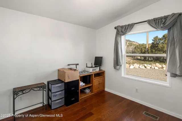 a patio with table and chairs