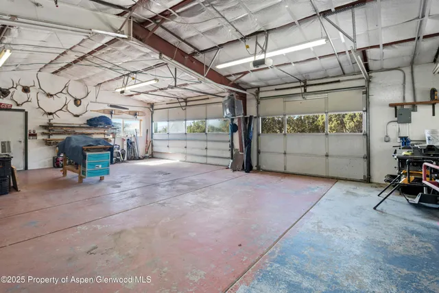 a view of a backyard with sitting area