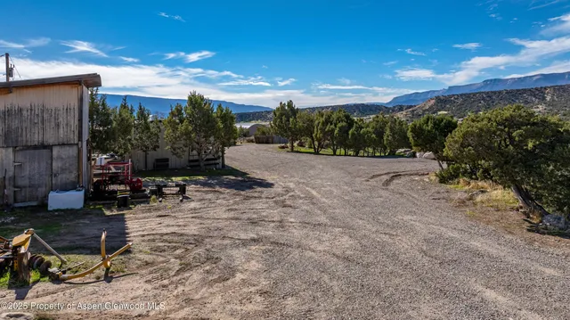 a view of parked car with city street