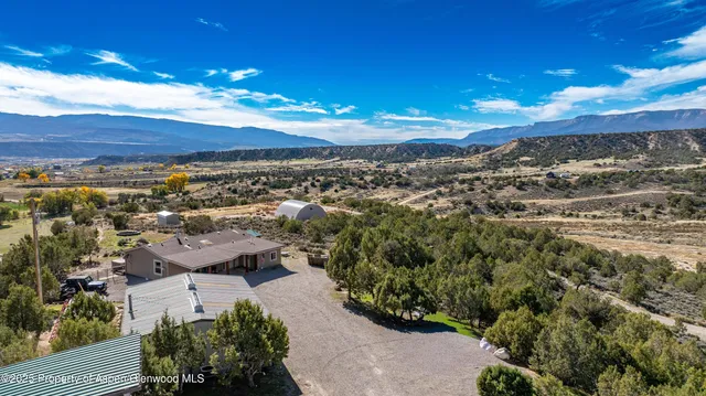 an aerial view of house with yard