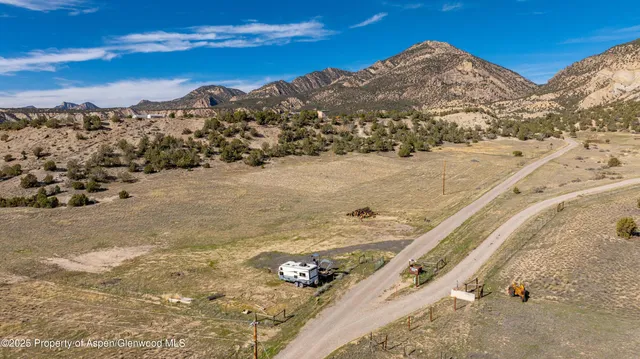 a view of a dry yard covered with snow