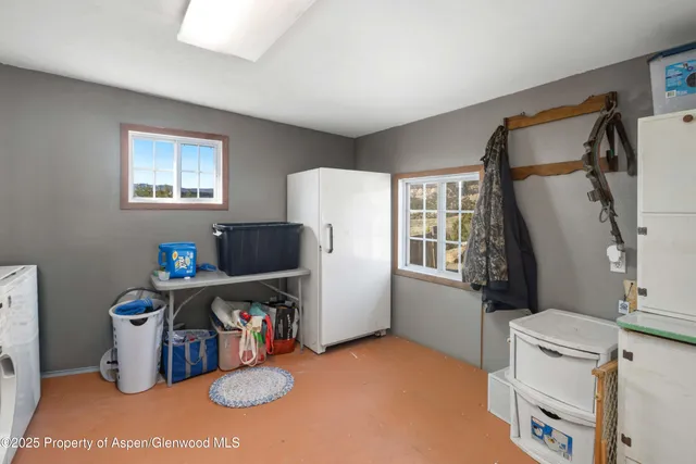 a view of workspace with furniture and window