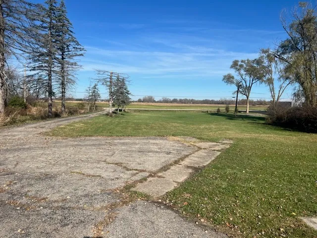 a view of a lake with a yard