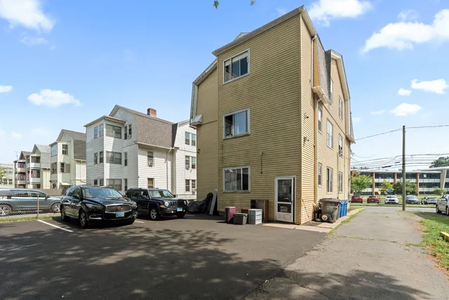 a view of a street with cars