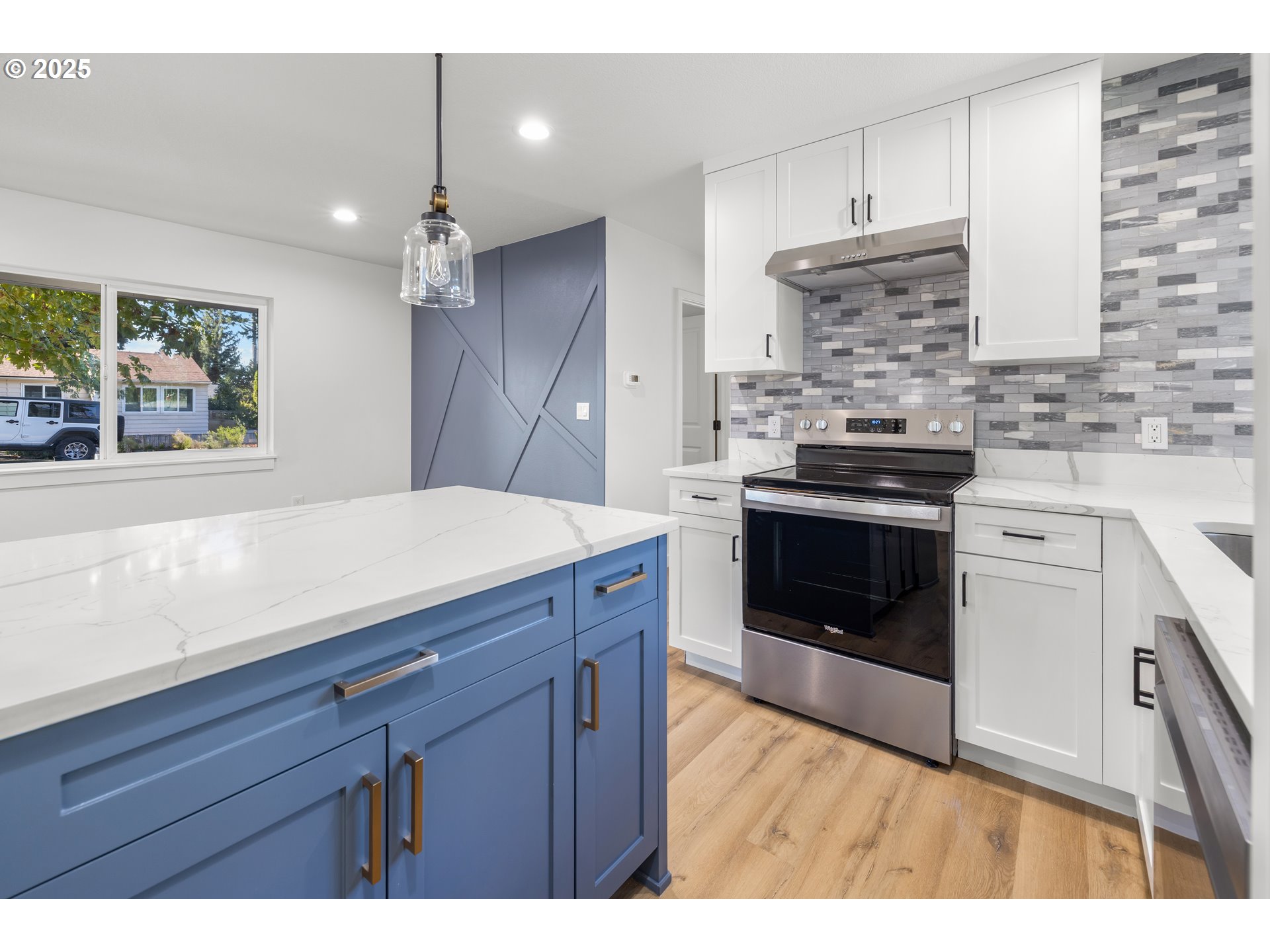 142 Northeast 128th Avenue Portland, OR 97230 - Photo 13 of 43 a kitchen with a stove and a sink
