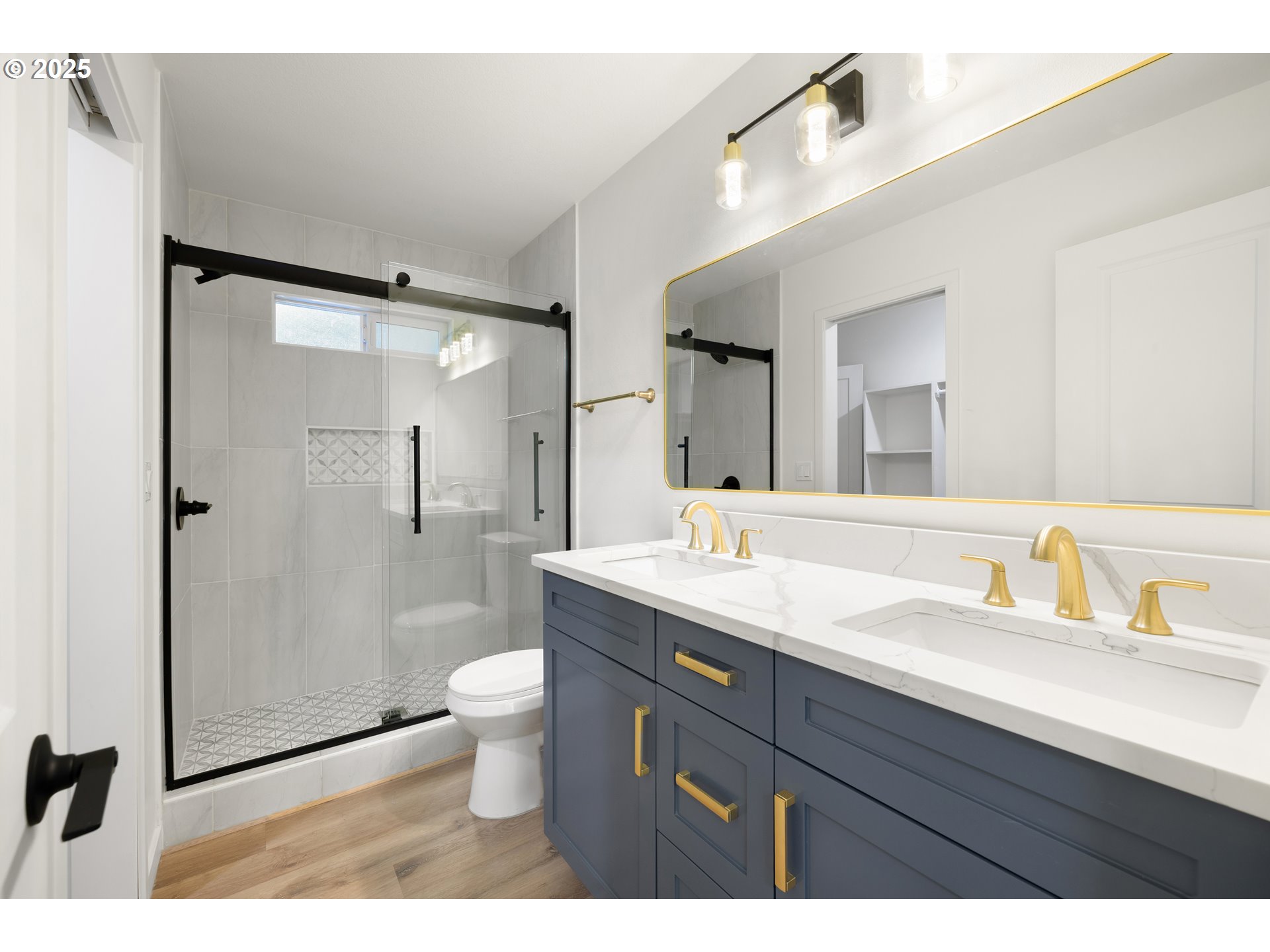 142 Northeast 128th Avenue Portland, OR 97230 - Photo 17 of 43 a bathroom with a granite countertop sink a toilet a mirror and shower