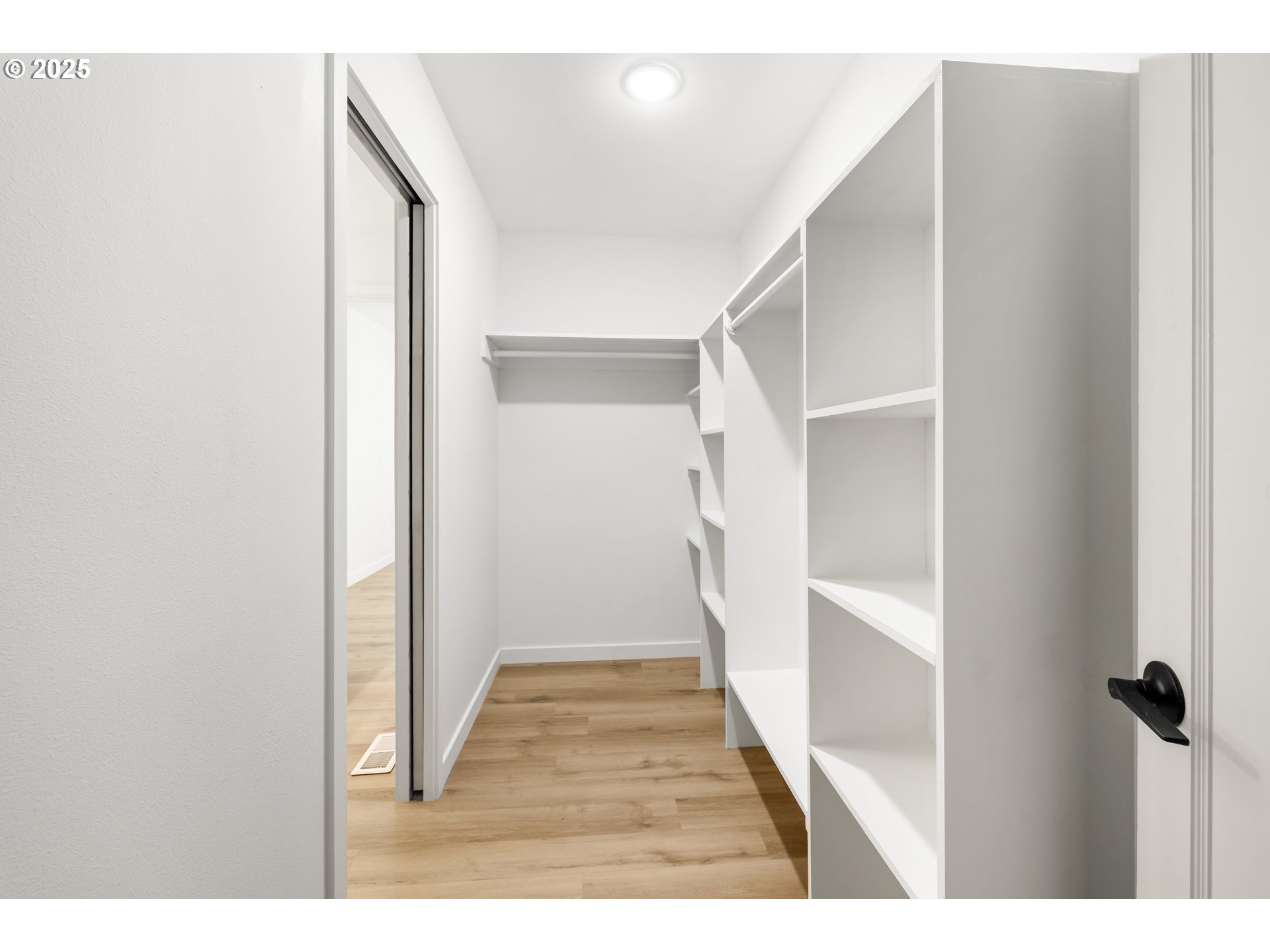142 Northeast 128th Avenue Portland, OR 97230 - Photo 19 of 43 a view of a hallway with wooden floor and staircase