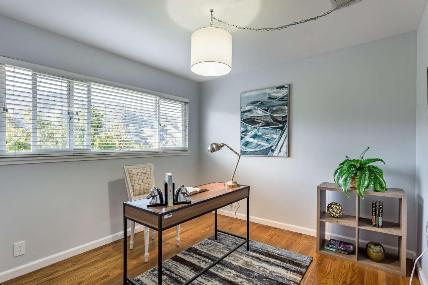 3 Yellowstone Way Pacifica, CA 94044 - Photo 17 of 21 a living room with furniture and a potted plant