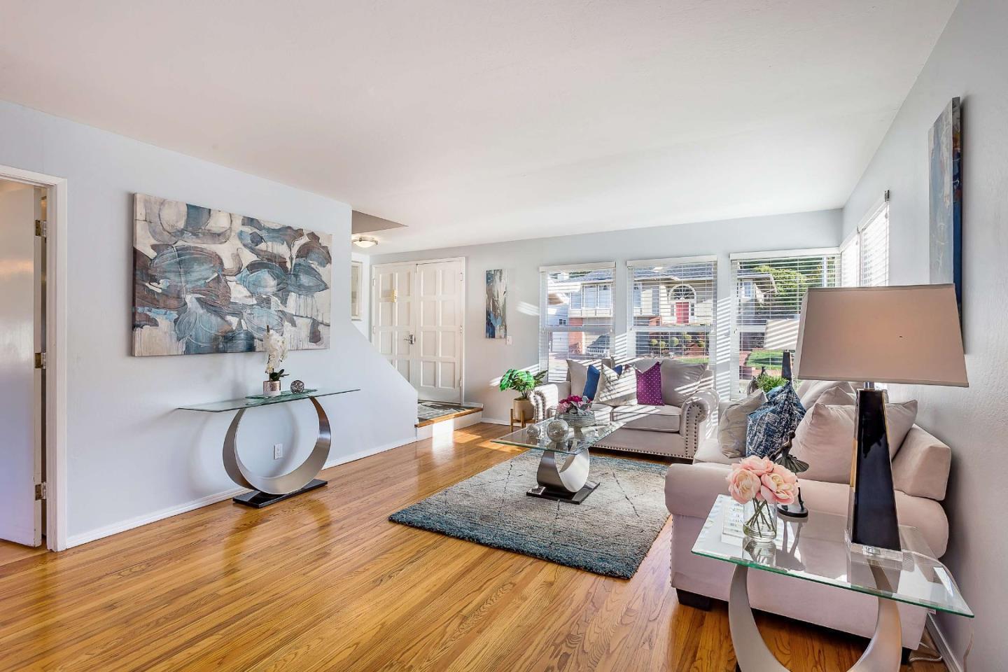 3 Yellowstone Way Pacifica, CA 94044 - Photo 3 of 21 a living room with furniture a window and gym equipment