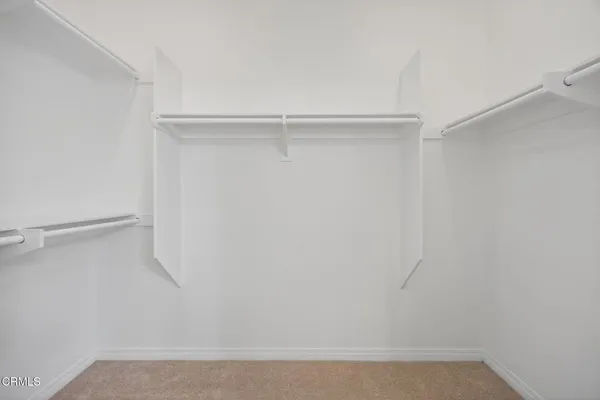 a view of an empty walk in closet