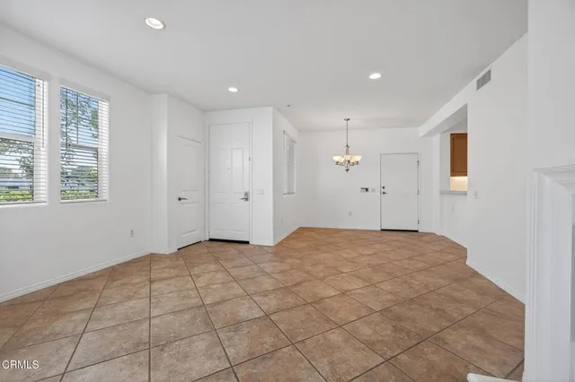 a view of an empty room and window