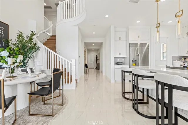 a living room with furniture gym and potted plant