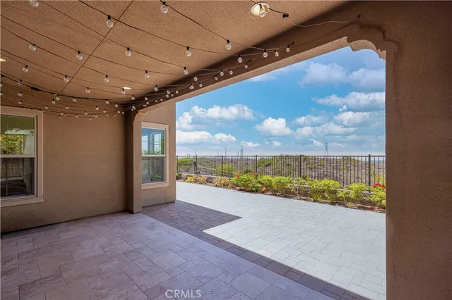 a bedroom with a large bed and a large window
