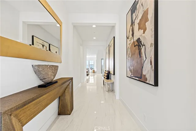 a view of a dining room with furniture and a window
