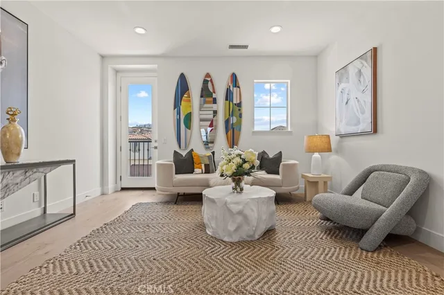 a view of a balcony with lake view and wooden floor