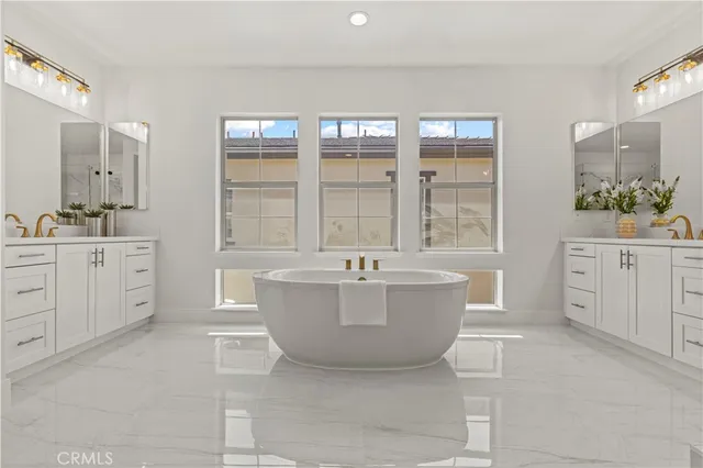 a bathroom with a granite countertop toilet sink and mirror