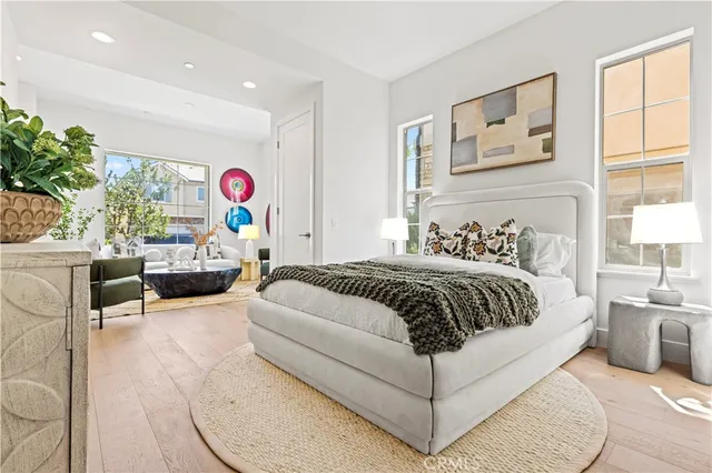 a living room with furniture a white wooden cabinets and a sink