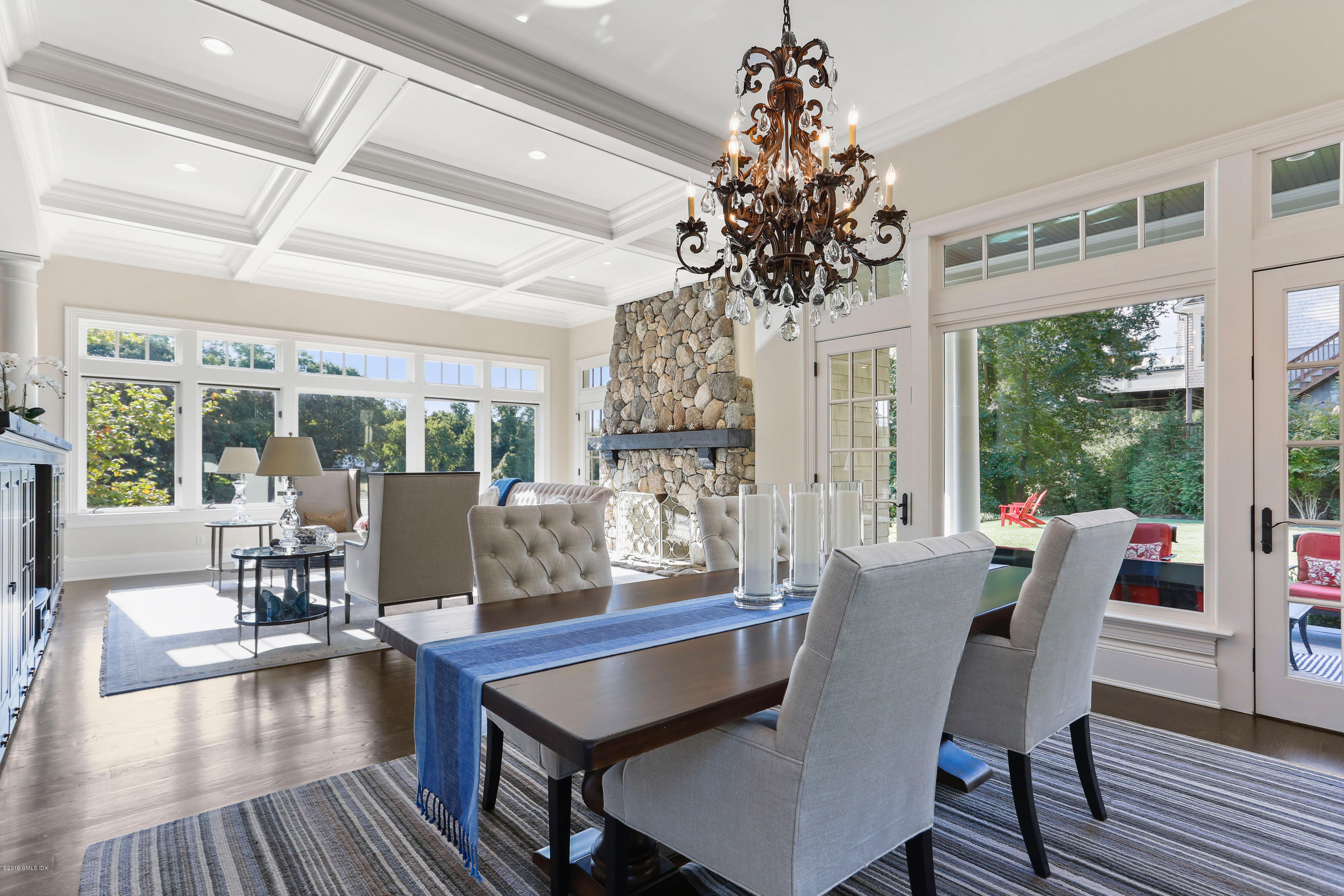 271 Valley Road Cos Cob, CT 06807 - Photo 12 of 42 a dining room with furniture wooden floor and a chandelier
