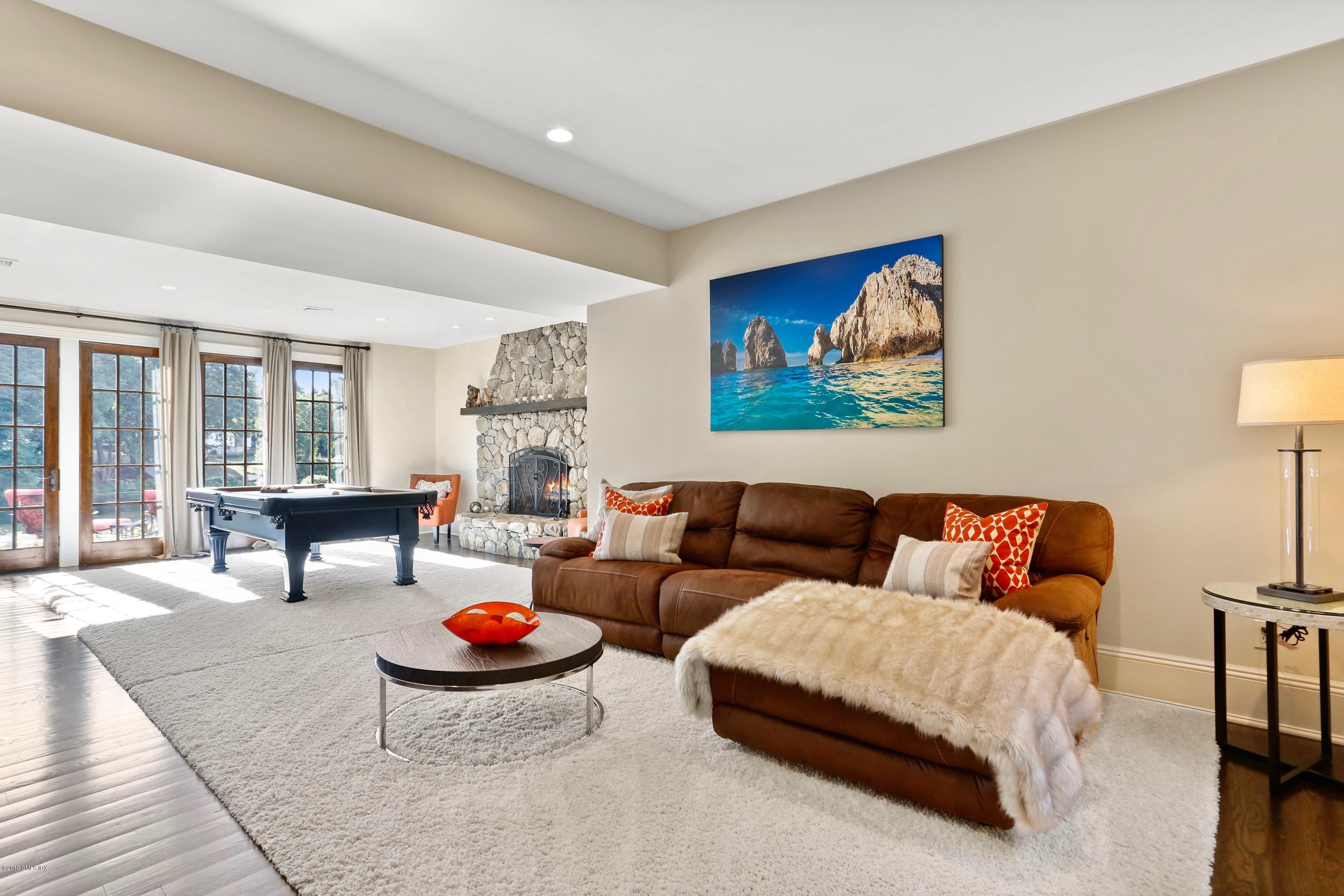 271 Valley Road Cos Cob, CT 06807 - Photo 14 of 42 a living room with furniture and a potted plant