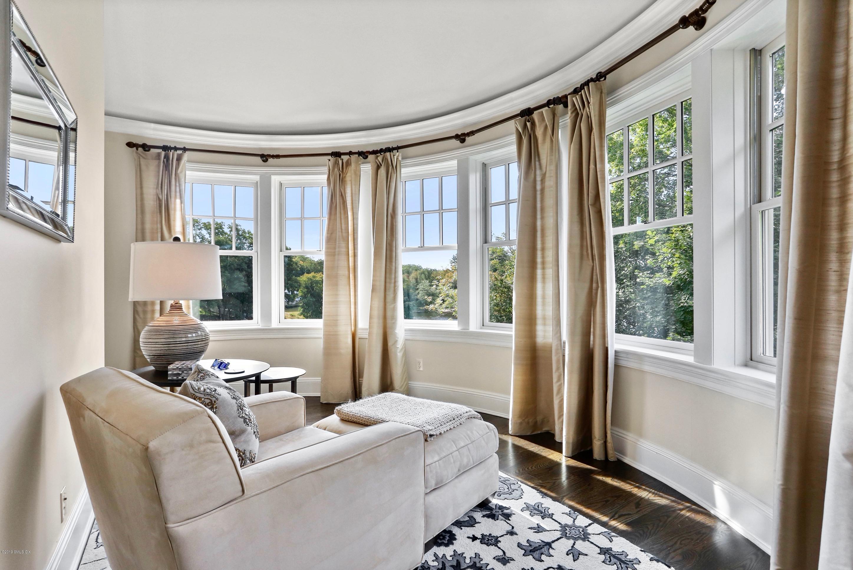 271 Valley Road Cos Cob, CT 06807 - Photo 19 of 42 a living room with furniture and a window