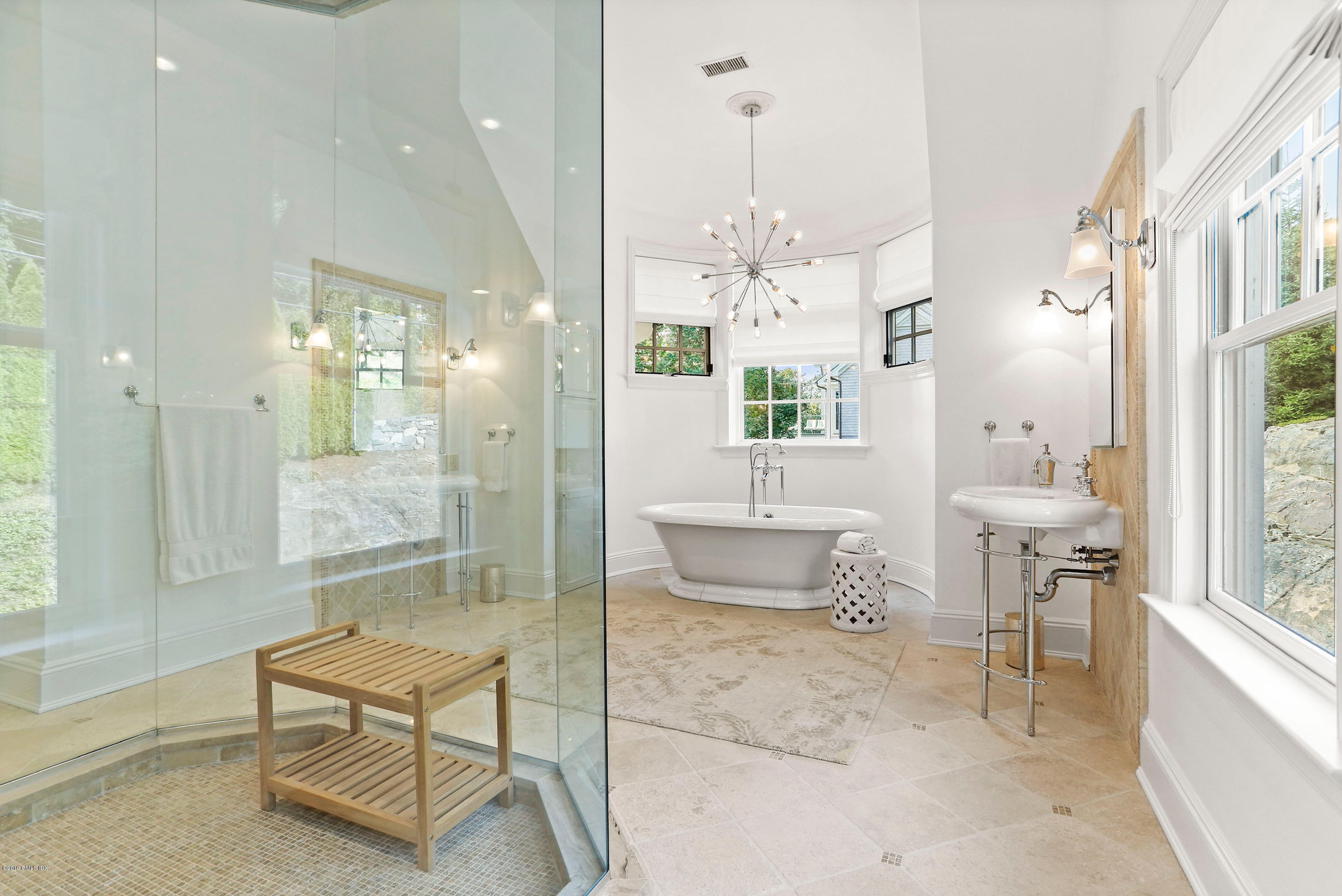 271 Valley Road Cos Cob, CT 06807 - Photo 20 of 42 a spacious bathroom with a glass shower door and a bathtub