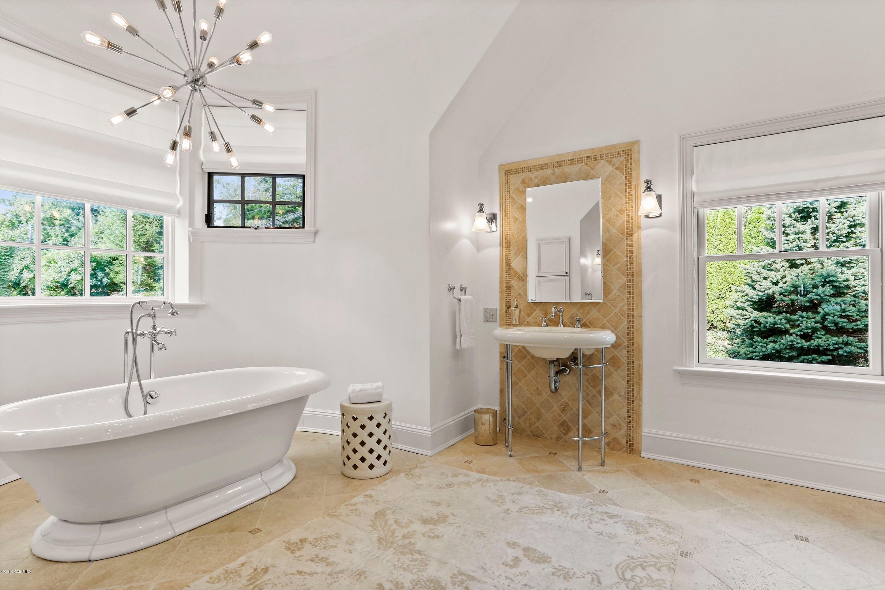 271 Valley Road Cos Cob, CT 06807 - Photo 21 of 42 a bathroom with a bathtub and a sink