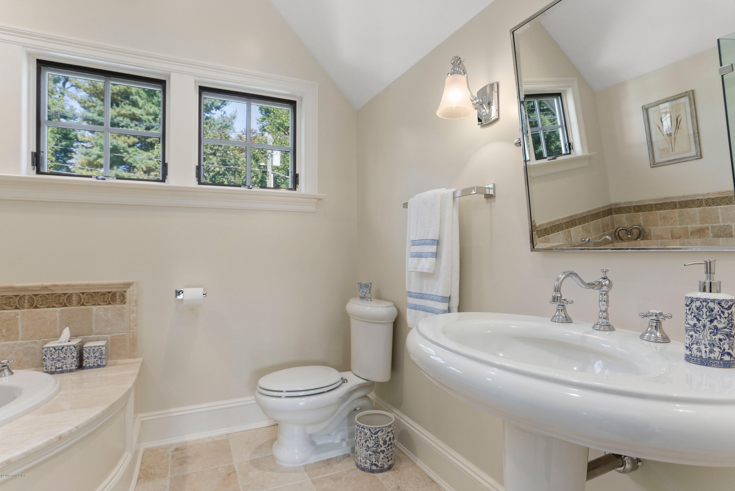 271 Valley Road Cos Cob, CT 06807 - Photo 25 of 42 a bathroom with a toilet sink and mirror