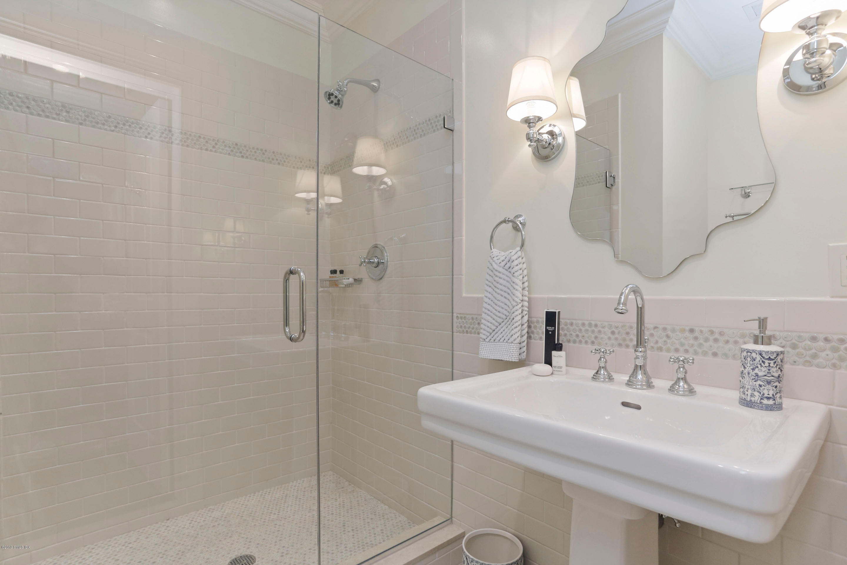 271 Valley Road Cos Cob, CT 06807 - Photo 29 of 42 a bathroom with a sink a mirror a vanity and shower