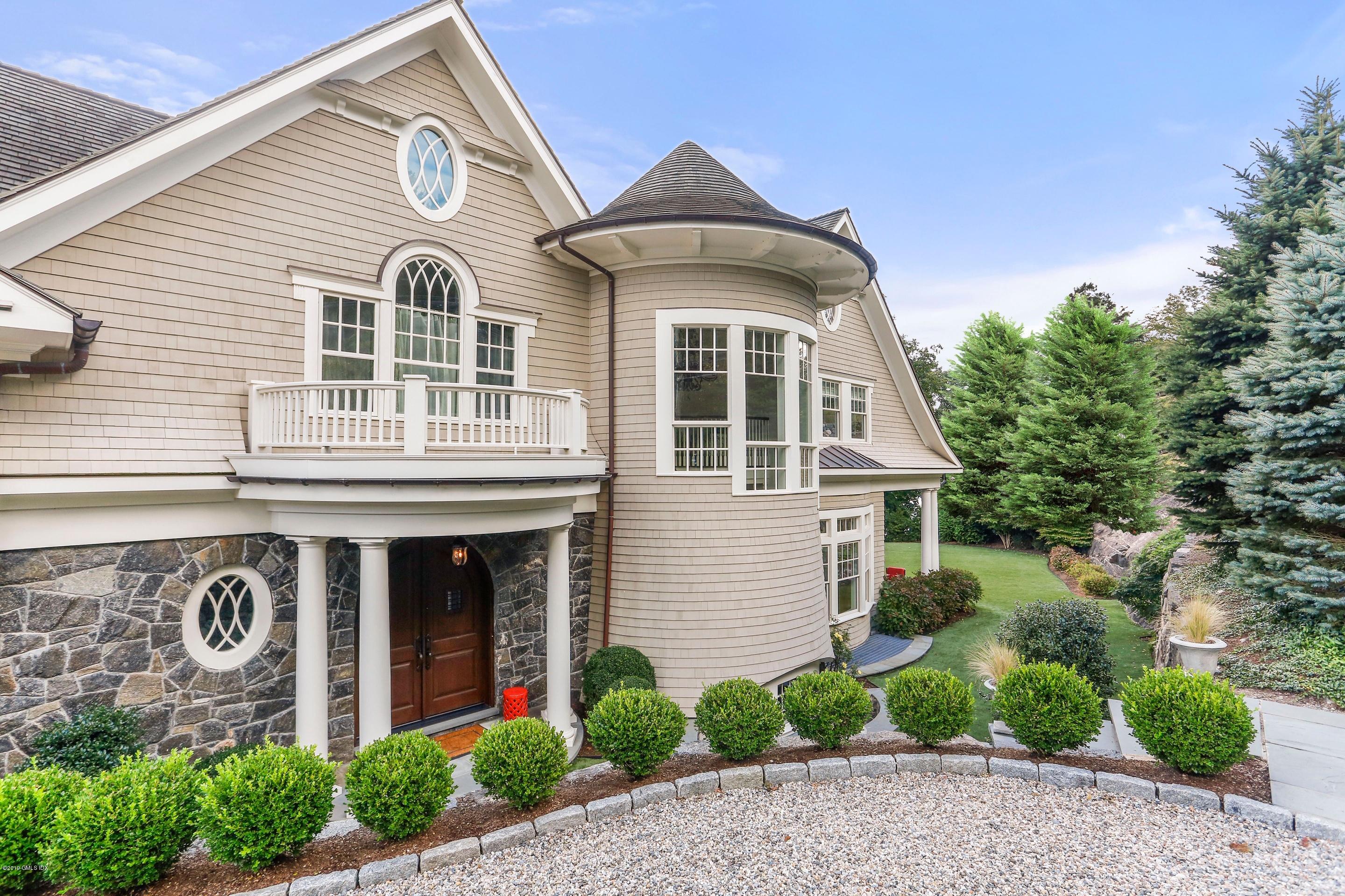 271 Valley Road Cos Cob, CT 06807 - Photo 3 of 42 a front view of a house with garden