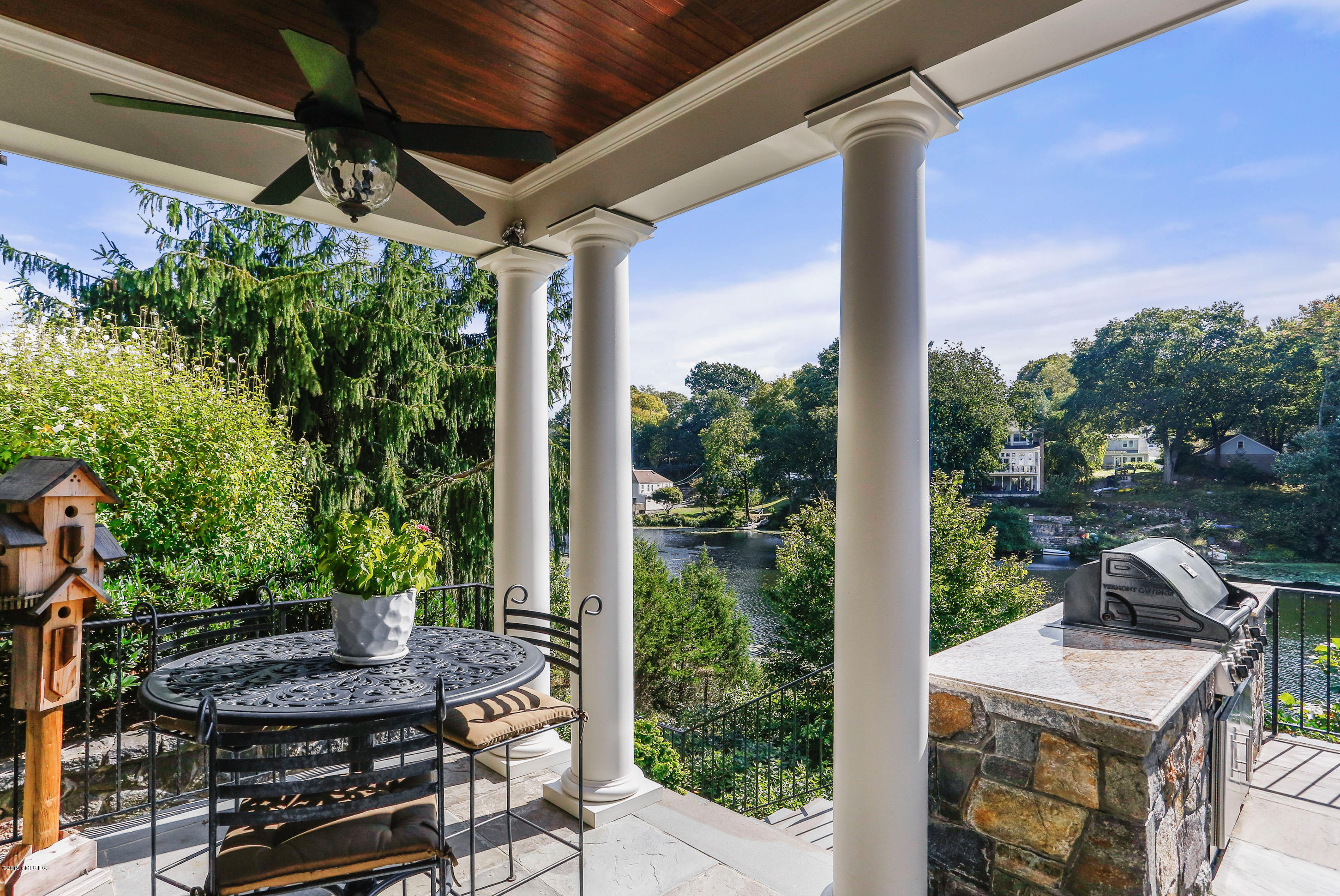 271 Valley Road Cos Cob, CT 06807 - Photo 38 of 42 a view of a patio with table and chairs and potted plants