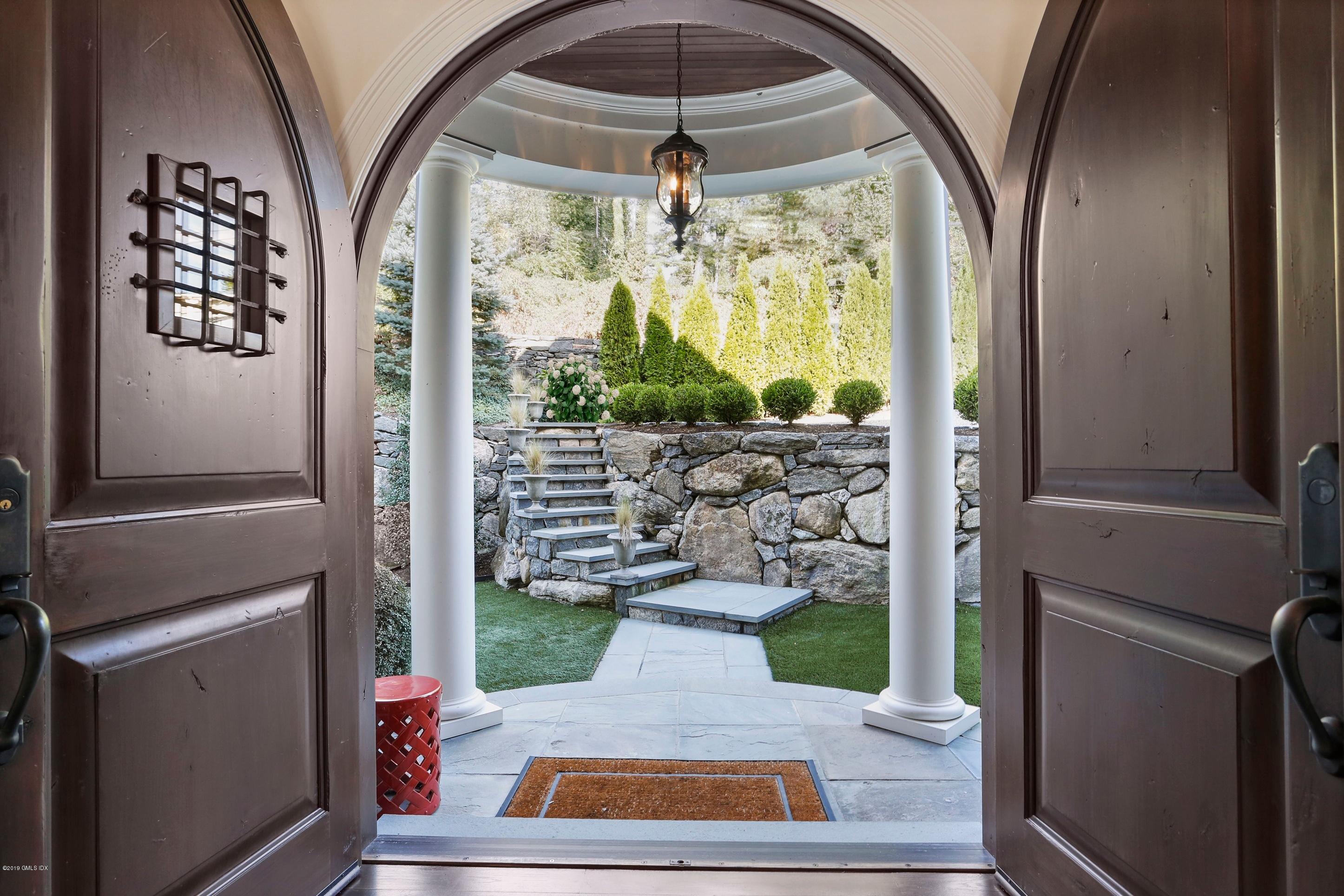 271 Valley Road Cos Cob, CT 06807 - Photo 4 of 42 a view of a entryway door of the house